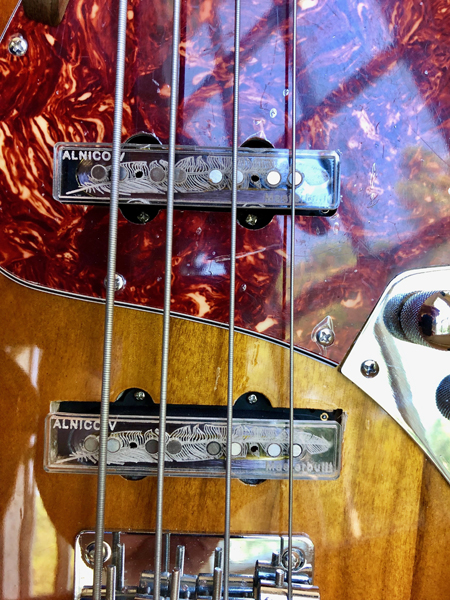 Alnico V Masterbuilt pickups with see-thru acrylic tops and feather etching. That's funky!