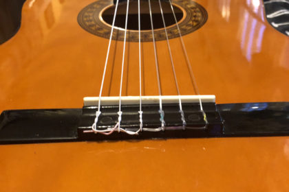 Classical guitar stringing - not bad for a first try!